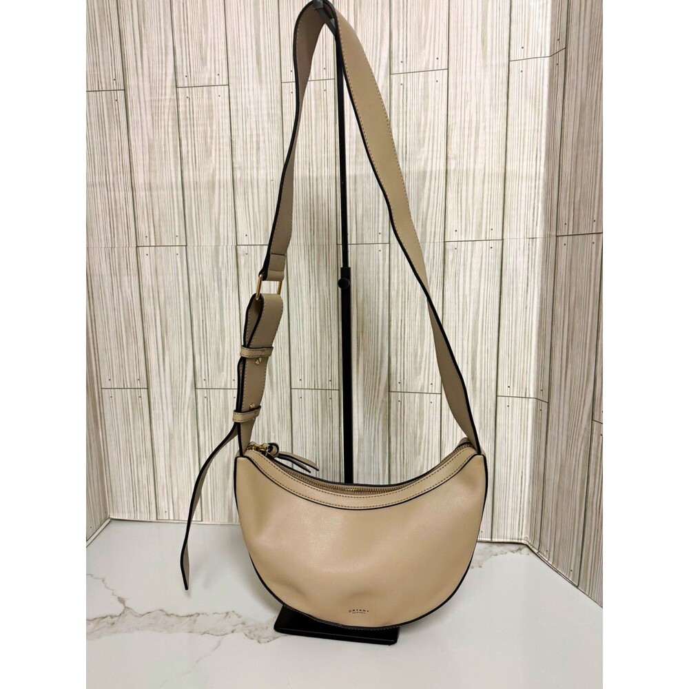 Oryany Beige Crescent Crossbody Bag Zip Top, Adjustable Strap